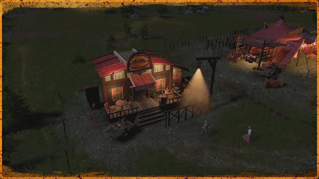 A saloon lit up at night beside a lamp post and a fenced yard